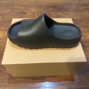 Brand new Black youth Yeezy slides size 3